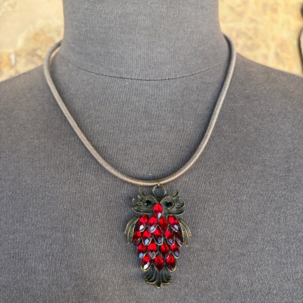 OWL Pendant suspended from a thick 20” Flexible cord Red stones